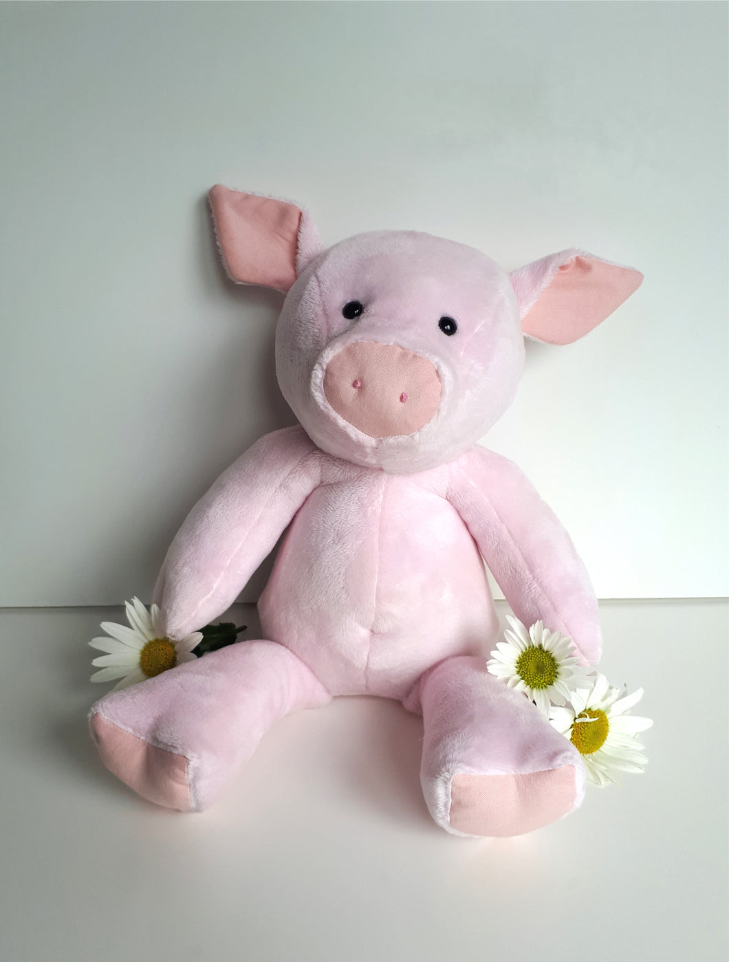 Handmade soft toy pig made with super soft Shannon cuddle solid fur fabric in baby pink.